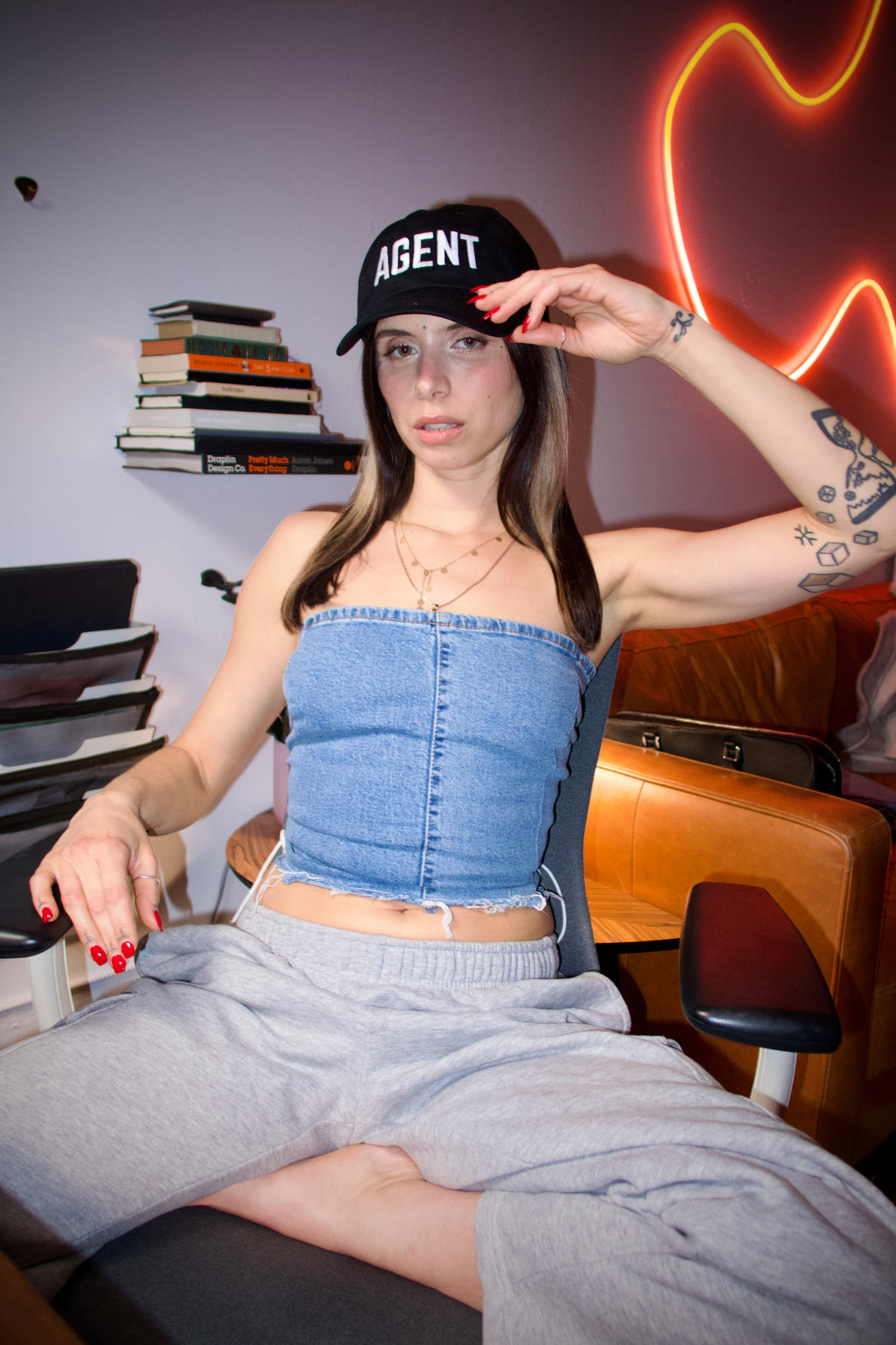 Agent black cap girl in artist office with a neon flash photo 